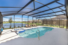 Extended Sunny Pool Deck with Pool and Spa and Lake View in Gated Solterra Resort
